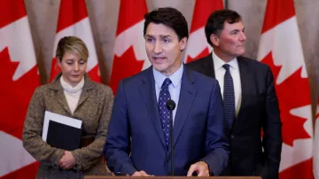 Canada's Prime Minister Justin Trudeau with Foreign Minister Melanie Joly and Public Safety Minister Dominic LeBlanc.