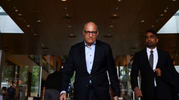 Former transport minister S. Iswaran walks after appearing at the Supreme Court in Singapore October