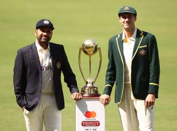 Rohit Sharma and Pat Cummins with the BGT trophy.