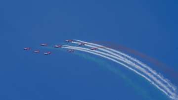 Indian Air Forces aerobatics team Surya Kiran performs during an air show as part of the 92nd anniversary celebrations of IAF at Marina Beach in Chennai. 