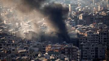 Thick smoke rises over Beirut's southern suburbs from a generator that caught fire, according to residents.