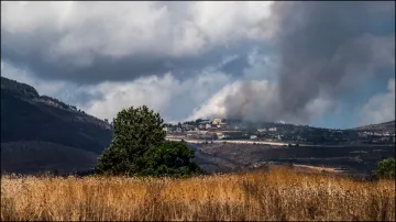 Smoke rises following Israeli strikes in Lebanon, amid cross-border hostilities between Hezbollah and Israel.