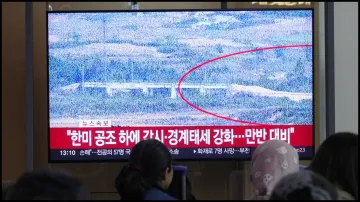 A TV screen in South Korea reports North Korea has blown up parts of northern side of inter-Korean roads.