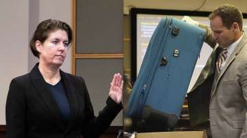 Prosecutor Dave Cacciatore Jr. takes out the suitcase in evidence  (R) and Defendant Sarah Boone, charged with leaving her boyfriend to die (L)