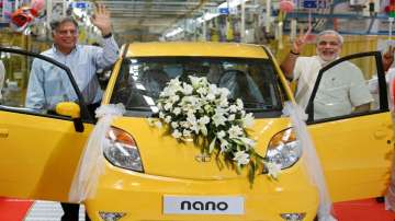 Ratan Tata and Narendra Modi attend an inauguration ceremony of a new plant for the Tata Nano, in Gu