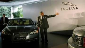 Ratan Tata posed with a Jaguar car