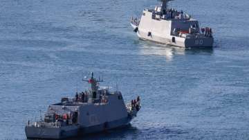 Taiwanese navy Kuang Hua VI-class missile boats move within the harbour of Keelung.