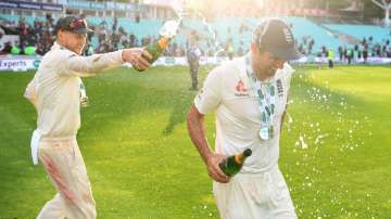 Joe Root celebrates with Alastair Cook.