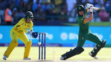 Lura Wolvaardt plays a shot through the offside with Alyssa Healy behind the stumps.