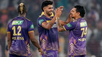 Harshit Rana and Sunil Narine celebrate a wicket.