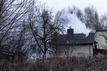 Smoke rises from the site where a DHL cargo plane crashed into a house near Vilnius, Lithuania.