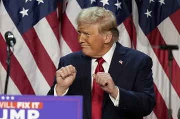 Republican Presidential nominee former President Donald Trump dances as former first lady Melania Tr