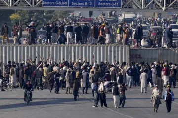 Supporters of imprisoned former Premier Imran Khan's Pakistan Tehreek-e-Insaf party move advance fol