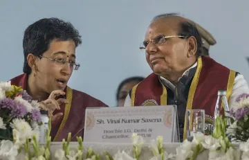 Atishi with VK Saxena