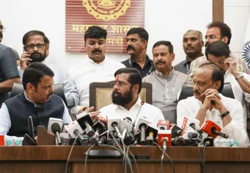 Eknath Shinde with Ajit Pawar and Devendra Fadnavis. 