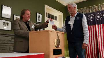 A man votes in the 2024 US presidential election on Election Day in Dixville Notch, New Hampshire, N