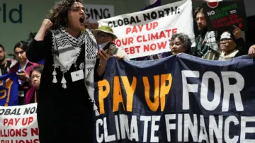 Activists participate in a demonstration for climate finance at the COP29 UN Climate Summit