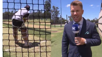 David Warner reports while Rohit Sharma bats in the nets at the Optus Stadium.