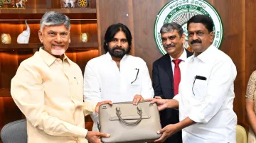 Finance Minister Payyavula Keshav presenting the copies of the Andhra Pradesh budget to Chief Minister N. Chandrababu Naidu and Deputy Chief Minister K. Pawan Kalyan.