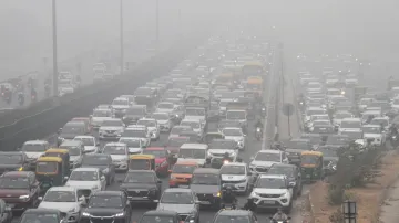 Gurugram: Vehicles move on the Delhi-Gurugram expressway amid low visibility due to fog in Gurugram.