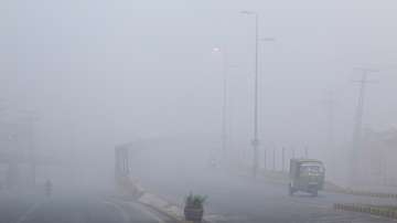 A view of vehicles amid smog along a highway in Multan in Pakistan