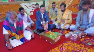 India TV Chairman and Editor-in-Chief Rajat Sharma, along with Acharya Pramod Krishnam offers prayer at Shri Kalki Dham 