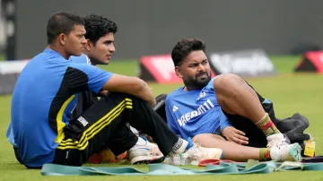 Rishabh Pant sitting alongside Yashasvi Jaiswal and Shubman Gill on the sidelines of a practice sess