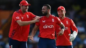 Saqib Mahmood celebrates a wicket with teammates Jamie Overton and Phil Salt.