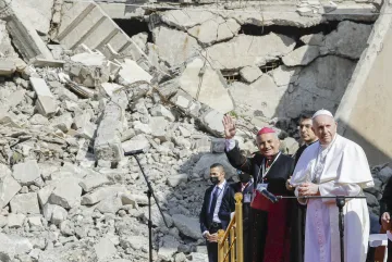 Mosul and Aqra Archbishop Najib Mikhael Moussa, left, waves as he stands next to Pope Francis at the