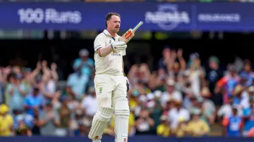 Travis Head celebrates his century at the Gabba against India.