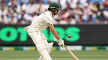 Sam Konstas plays a reverse scoop against Jasprit Bumrah.