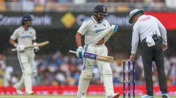 Rohit Sharma and KL Rahul run off after the final rain break at Gabba on Day 3 of the third Test