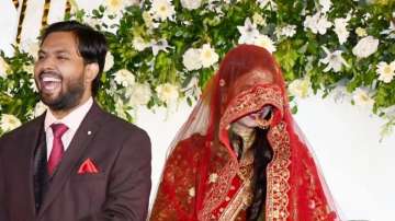 Khan Sir Introduces Wife AS Khan at Patna Wedding Reception: Bride's Red Lehenga Goes Viral 4 Khan Sir's wife makes first public appearance at reception party in Patna | Pics and Videos | Bihar News – India TV
