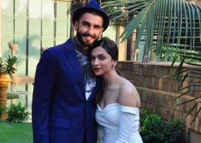 Ranveer Singh holds wife Deepika Padukone's heels at a wedding