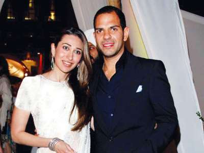 Bollywood actress Karisma Kapoor has officially ended her 13 years marriage with business man husband Sanjay Kapur. The two who got married in 2003 have two kids - daughter Samaira and son Raj.
Karisma and Sunjay have been fighting their divorce case from mid 2014. The two even made shocking allegations against each other. While Karisma filed a dowry harassment case against her estranged hubby, Sunjay too accused the actress for marrying him for just money.
Now the couple has finally got divorced on mutual consent and Karisma has got the custody of their kids.
Here we bring the love story of now ex-couple Karisma Kapoor and Sunjay Kapur:
