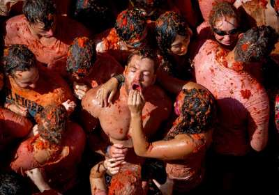 Spanish town of Bunol celebrated one of the world's most popular food fights, La Tomatina festival on August 31. This food fight has been held in the Valencian town of Bu&ntilde;ol in Spain since 1945.In picture participants can be seen pelting each other with tomato pulp.