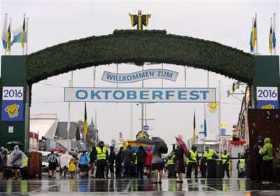 The world's largest and most famous beer festival, the Oktoberfest began on September 17 in the German city of Munich. It is a 17-day festival. In pic, visitors walk past security personnel through the main entrance of the Oktoberfest beer festival.