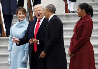 President Donald Trump and first lady Melania Trump talk with former President Barack Obama and Michelle Obama during a departure ceremony on the East Front of the U.S. Capitol in Washington