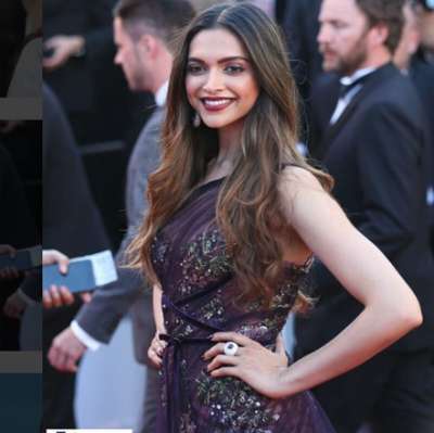 Deepika Padukone looked stunning in Marchesa Notte off-shoulder maroon gown at Cannes film Festival 2017.