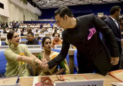 Best Actor award winner Akshay Kumar greets actress Sonam Kapoor as Best actress award winner Surabhi Jyoti looks on, at the 64th National Film Awards function at Vigyan Bhavan in New Delhi on Wednesday. Kumar is being honoured for his film Rustom and Jyoti for her role in film Minnaminungu-The Firefly. 