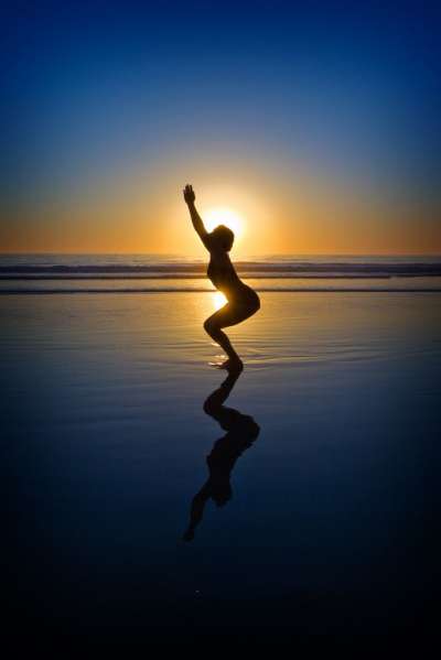 A woman doing yoga on the beach at sunset Image & Design ID 0000276620 -  SmileTemplates.com