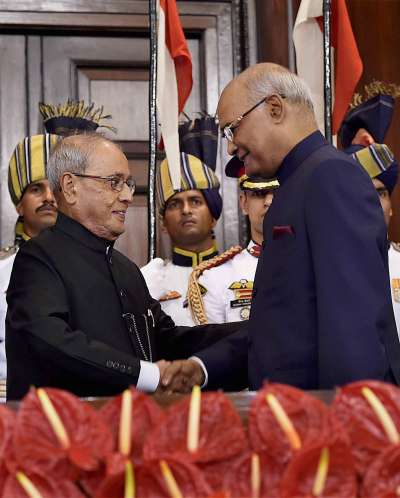 Newly appointed President Ram Nath Kovind and his predecessor Pranab Mukherjee exchanging chairs after the former took oath at a special ceremony in the Central Hall of Parliament