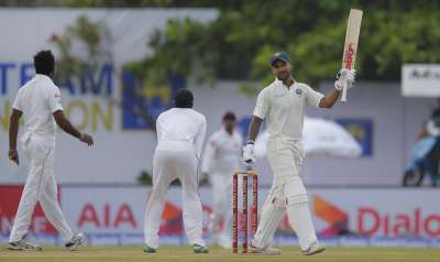 Shikhar Dhawan celebrates scoring century during the first day's play of the Galle Test