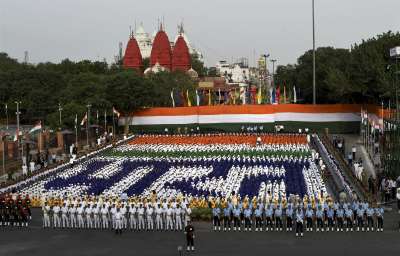 Schoolchildren create a formation during the full dress rehearsal for the Independence Day celebrations at the Red Fort in New Delhi on Sunday. 