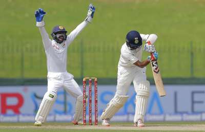 Wicketkeeper Niroshan Dickwella appeals successfully for the wicket of Cheteshwar Pujara during the second Test in Colombo