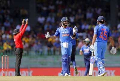 Virat Kohli reacts after Rohit Sharma hit a maximum during 4th ODI vs Sri Lanka in Colombo