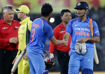 Mahendra Singh Dhoni celebrates with Manish Pandey after India won the third ODI against Australia in Indore on Sunday