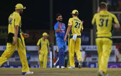 Australian cricketers congratulate Indian cricket captain Virat Kohli after India beat Australia in the first T20I by 9 wickets in Ranchi on Saturday.