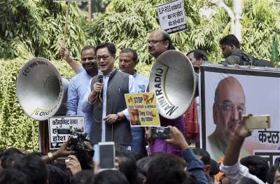 Union Minister Kiren Rijiju addresses the BJP workers during their Jan Raksha Yatra to protest against the alleged killing of RSS and BJP workers in Kerala, outside the CPOI(M) office in New Delhi on Monday