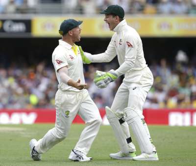 Australian critics questioned the quality of the England squad ahead of the first Test, and veteran Australian players David Warner and Nathan Lyon attracted headlines for some hostile commentary about the series. Australia's David Warner, left, celebrates with Tim Paine after getting the wicket of England's Jake Ball during the Ashes cricket test between England and Australia in Brisbane.